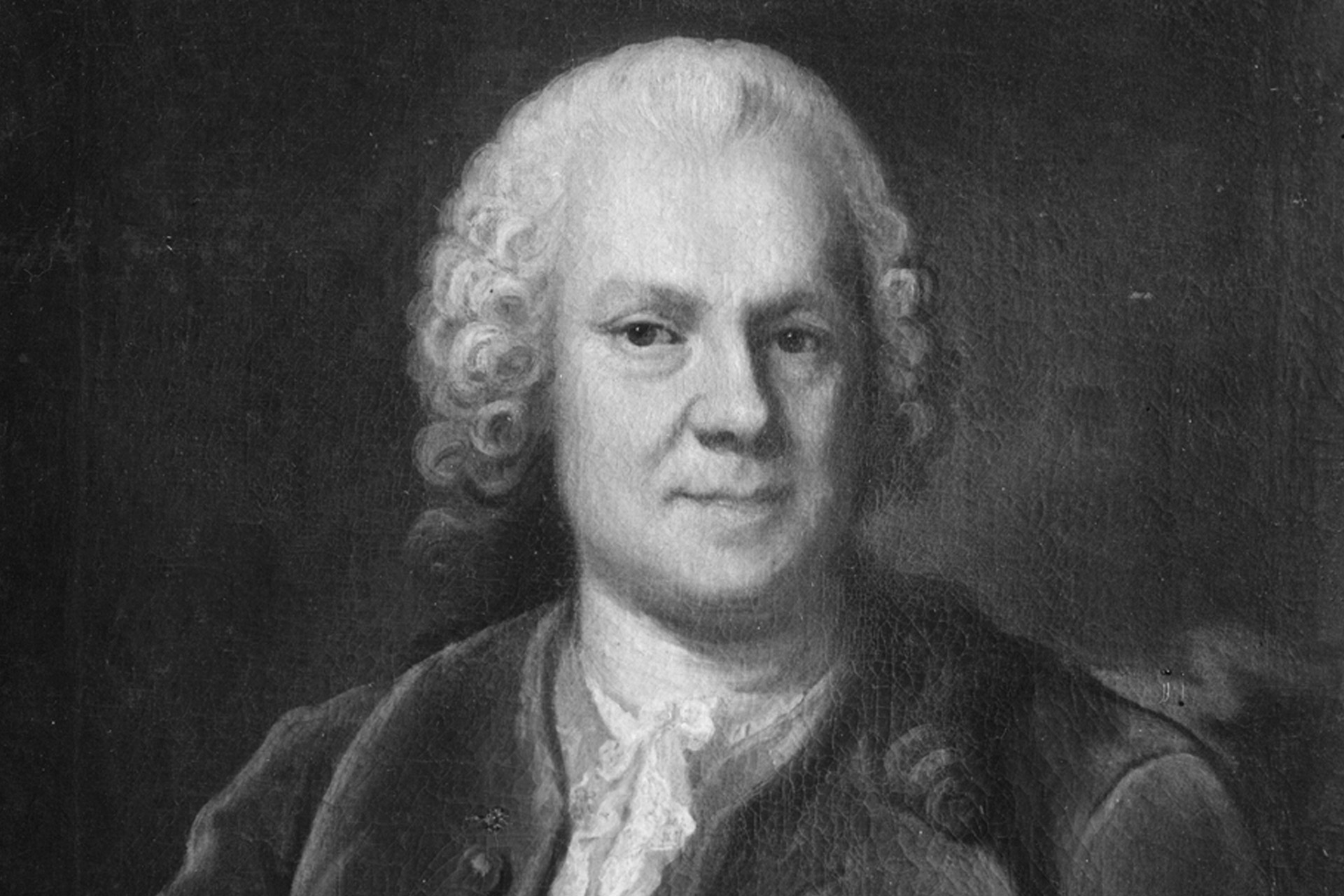 Svartvitt oljeporträtt av en man framifrån.